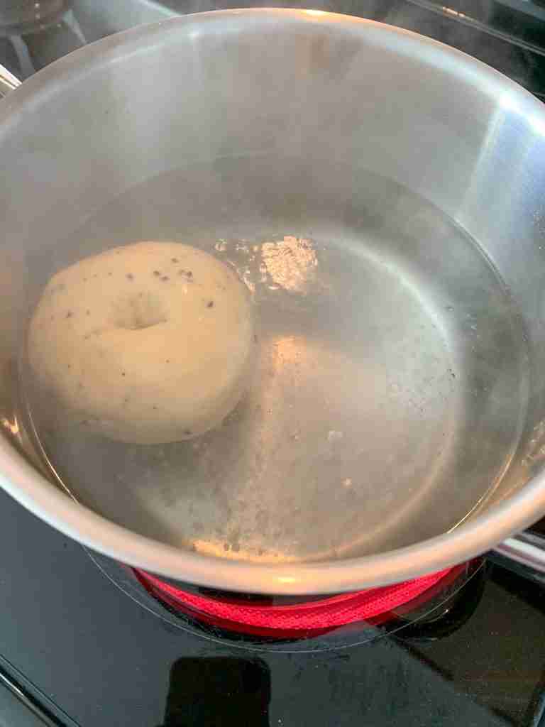 sourdough everything bagel in water bath