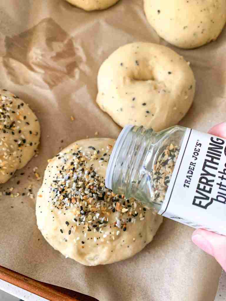 adding everything bagel seasoning to sourdough bagels