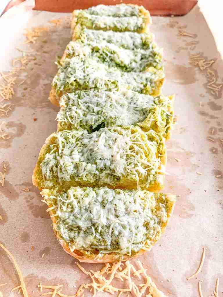 freshly baked sourdough pesto garlic bread sliced