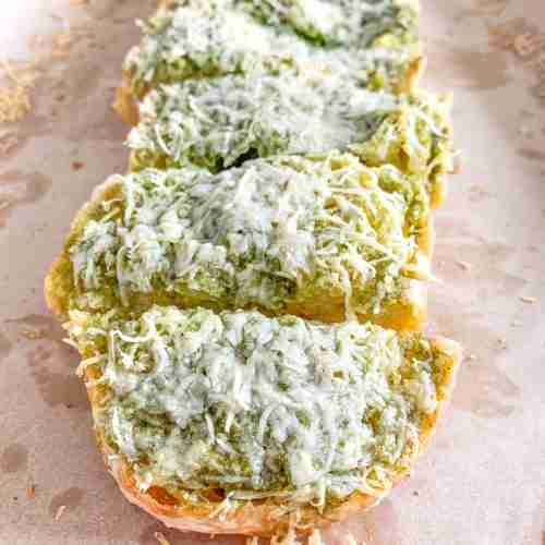 freshly baked sourdough pesto garlic bread sliced