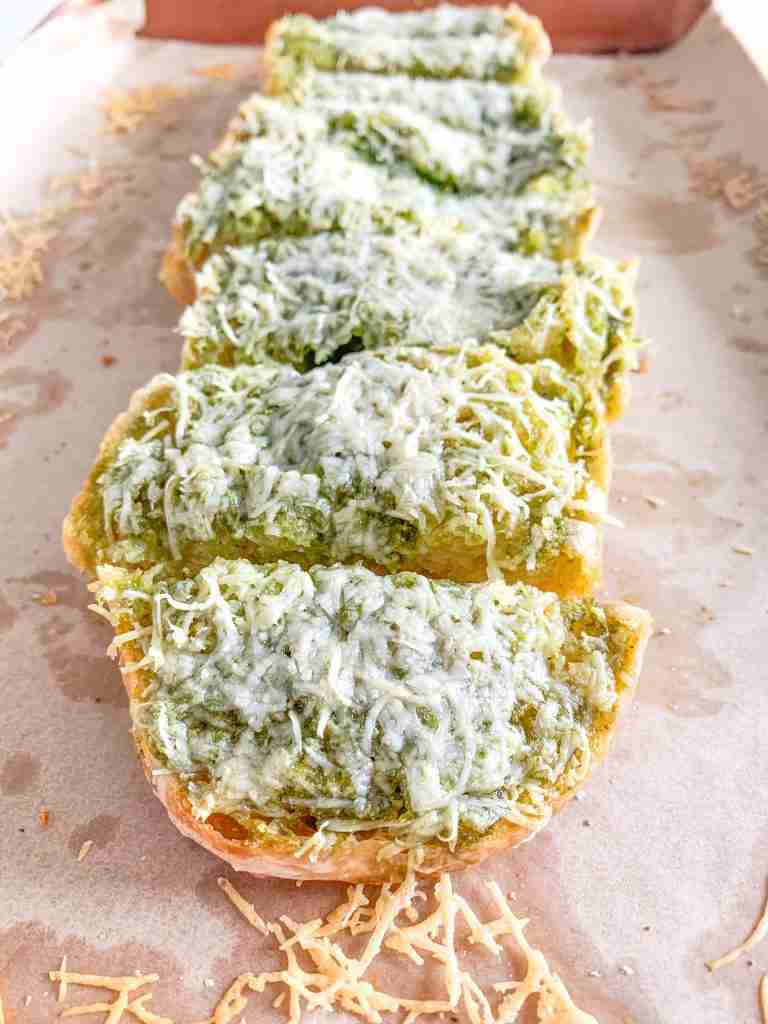 freshly baked sourdough pesto garlic bread sliced