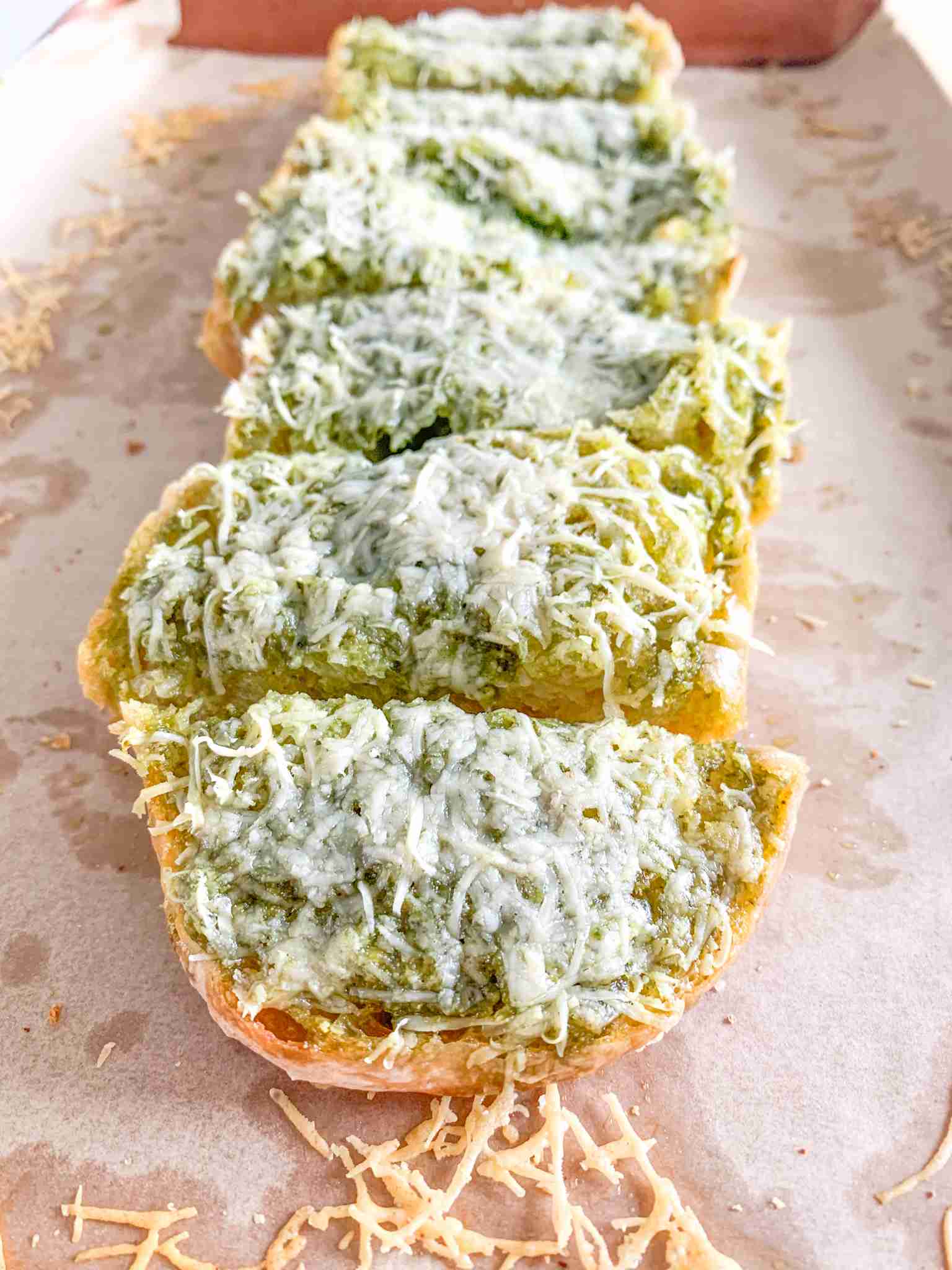 freshly baked sourdough pesto garlic bread sliced