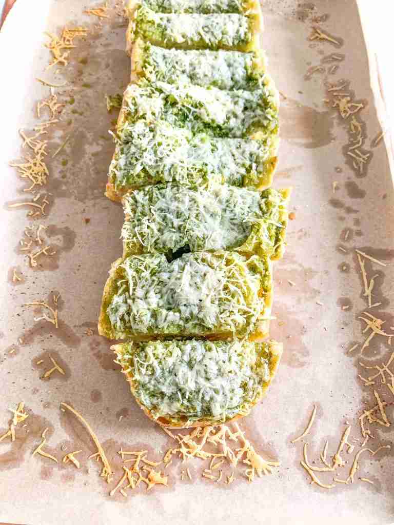 freshly baked sourdough pesto garlic bread sliced