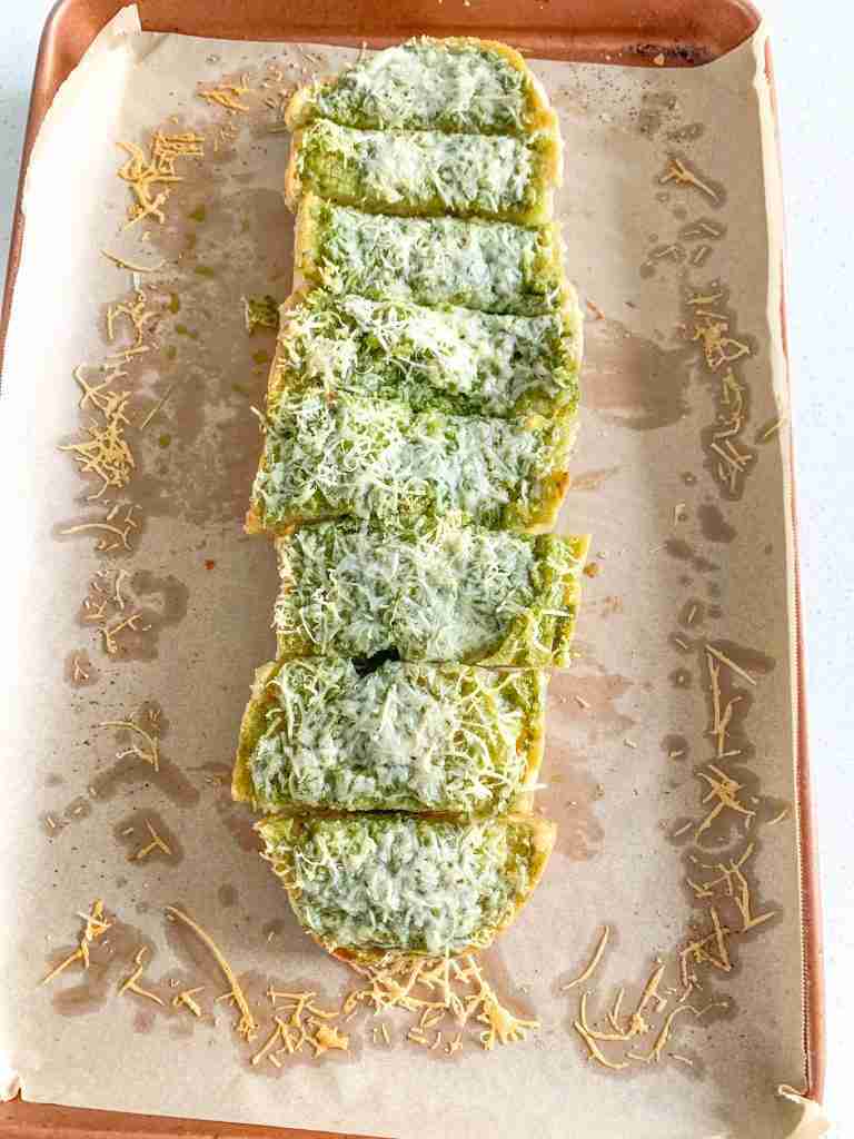 freshly baked sourdough pesto garlic bread sliced