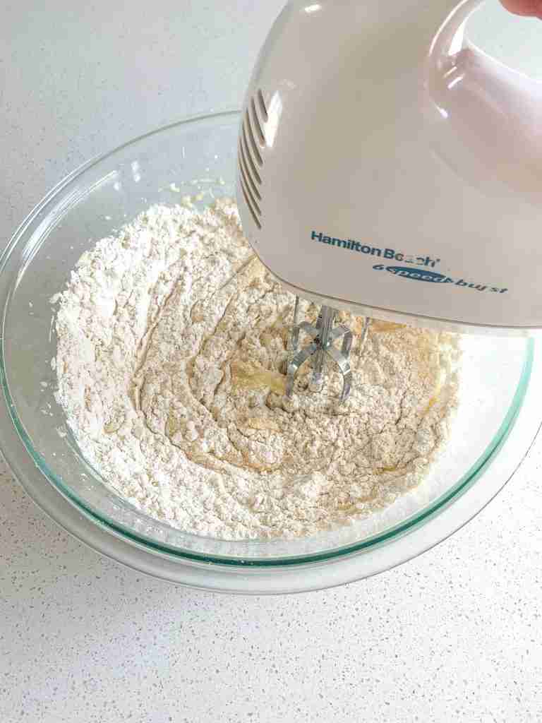 mixing flour into wet ingredients for sourdough lofthouse cookies