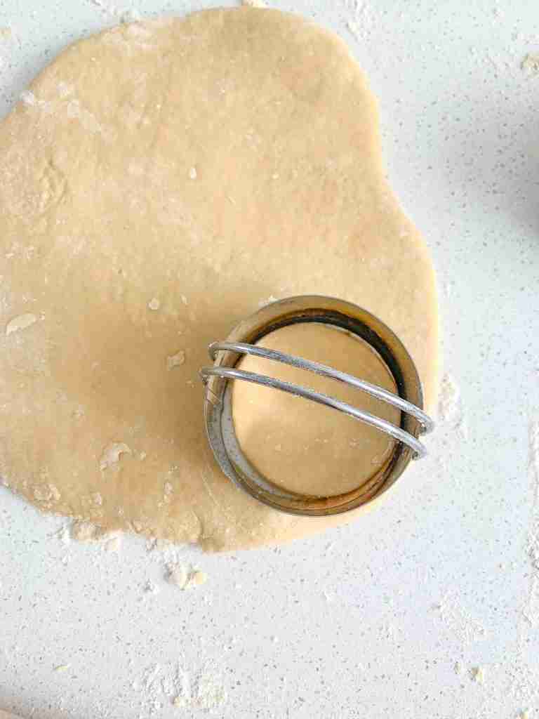 cutting out dough for sourdough lofthouse cookies