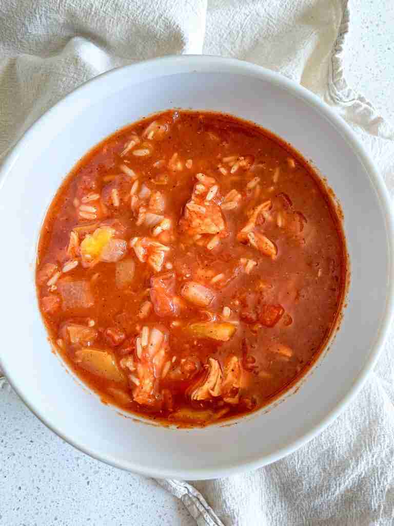 freshly cooked mexican chicken and rice soup in a bowl
