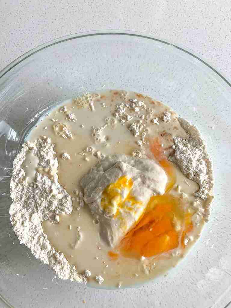 wet ingredients added into dry to make sourdough orange scones