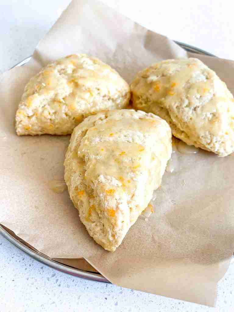 freshly baked sourdough orange scones with orange glaze