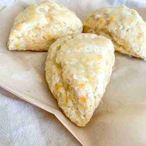freshly baked sourdough orange scones with orange glaze