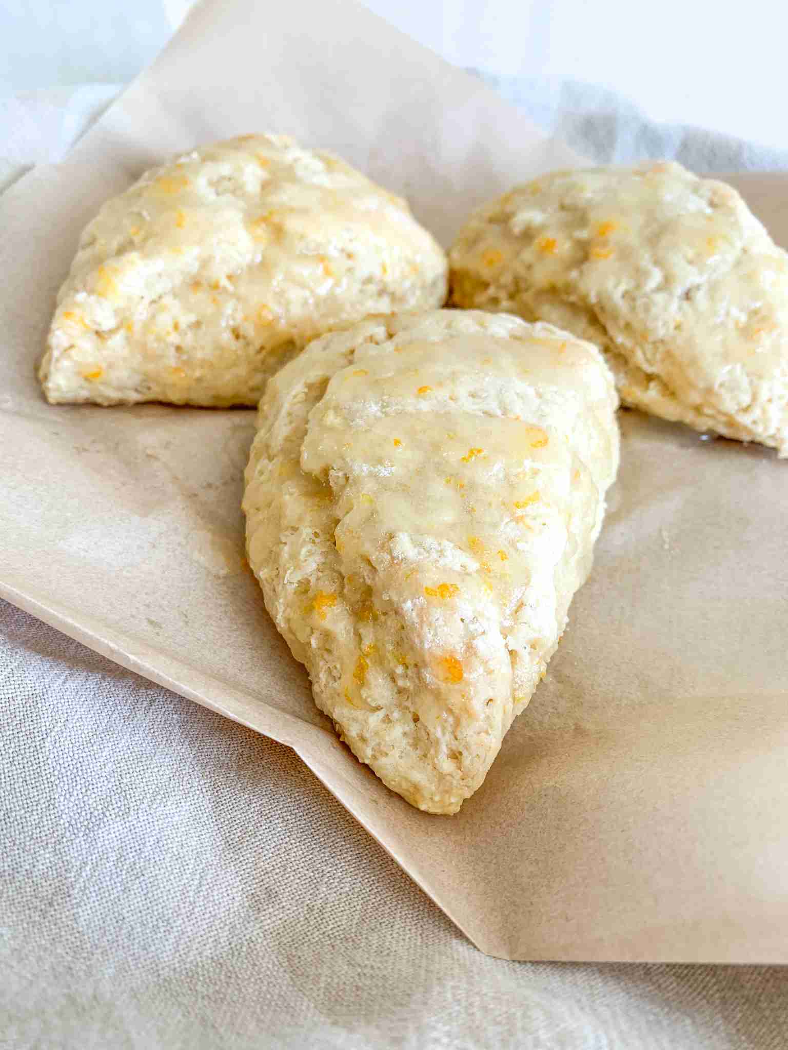 freshly baked sourdough orange scones with orange glaze