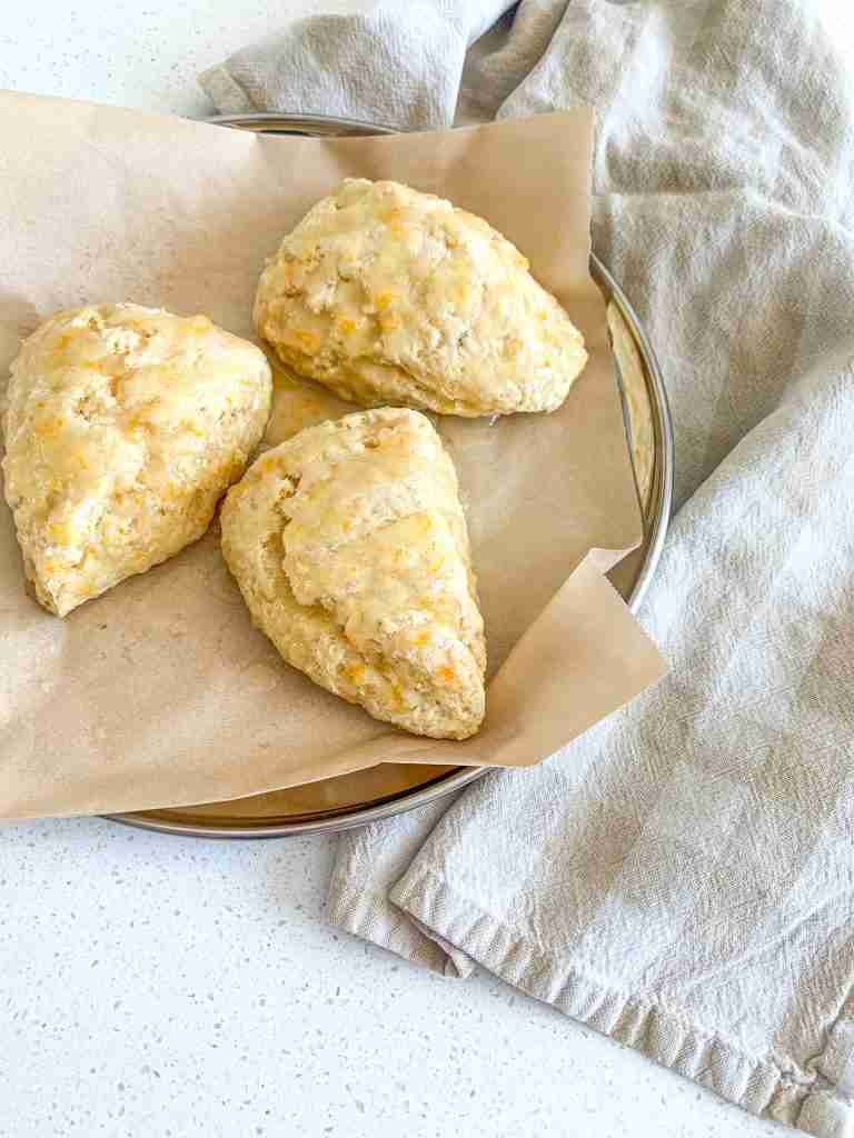 freshly baked sourdough orange scones with orange glaze