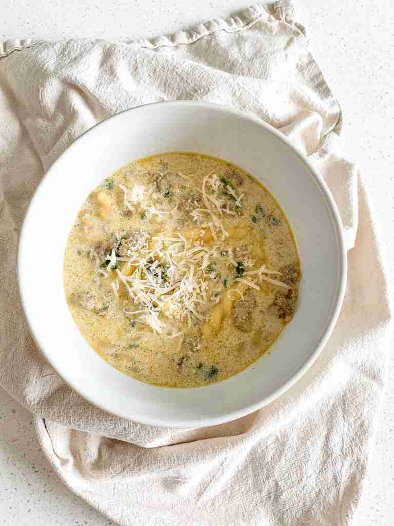 freshly cooked Creamy Parmesan Italian Sausage Soup in a bowl