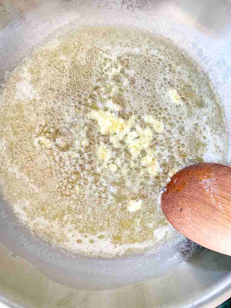 cooking fresh garlic minced in butter for better than olive garden alfredo sauce