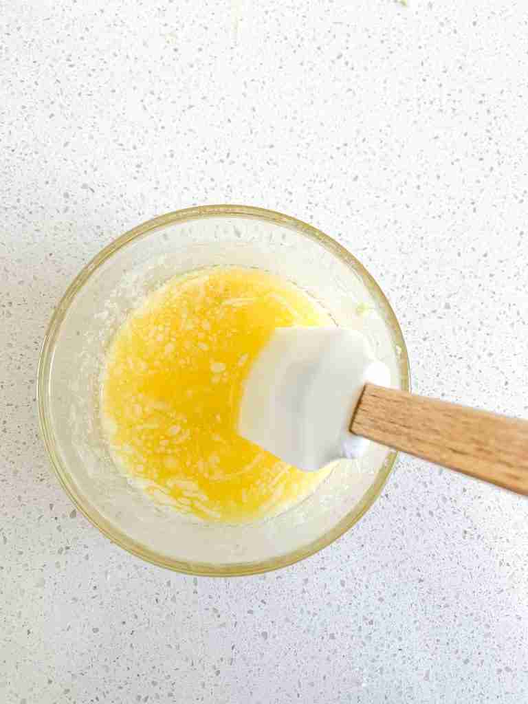 mixing filling for sourdough garlic pull apart bread
