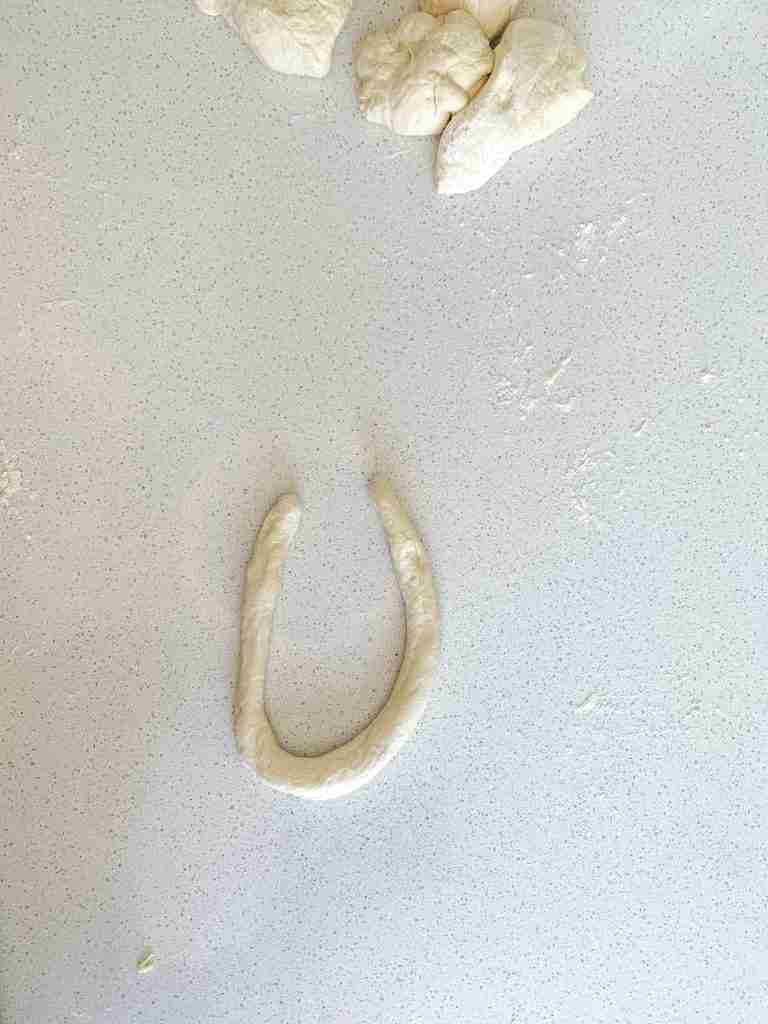 shaping sourdough soft pretzel