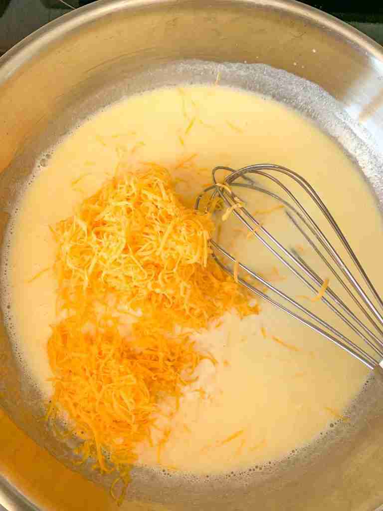 adding in cheese for jalapeno cheese dip