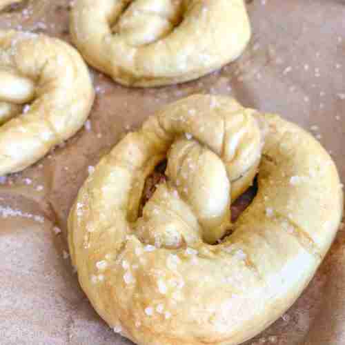 freshly baked and salted sourdough soft pretzels and cheese dipping sauces