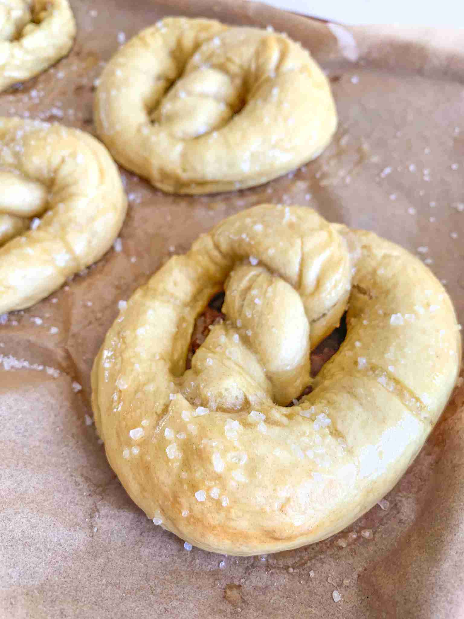 freshly baked and salted sourdough soft pretzels and cheese dipping sauces