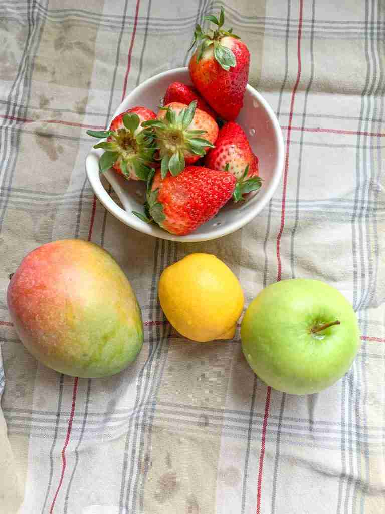 fresh fruits rinsed and getting dried for spring fruit salad