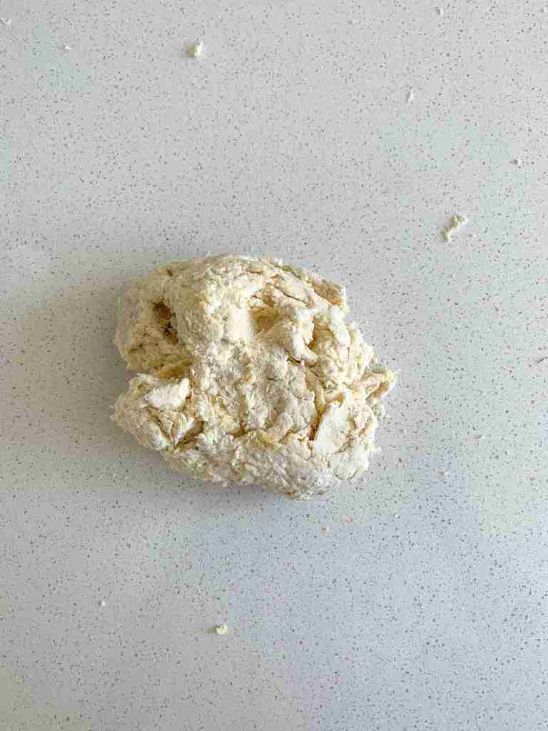 combining dough for sourdough breakfast sandwiches