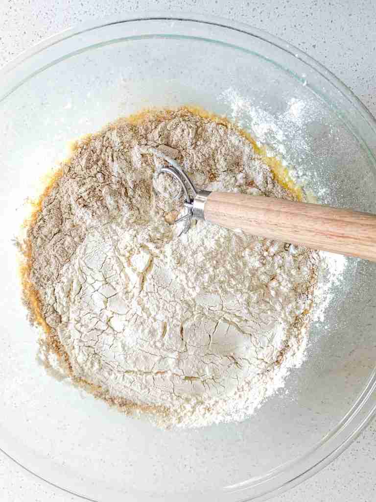 mixing dry ingredients to make sourdough pita bread