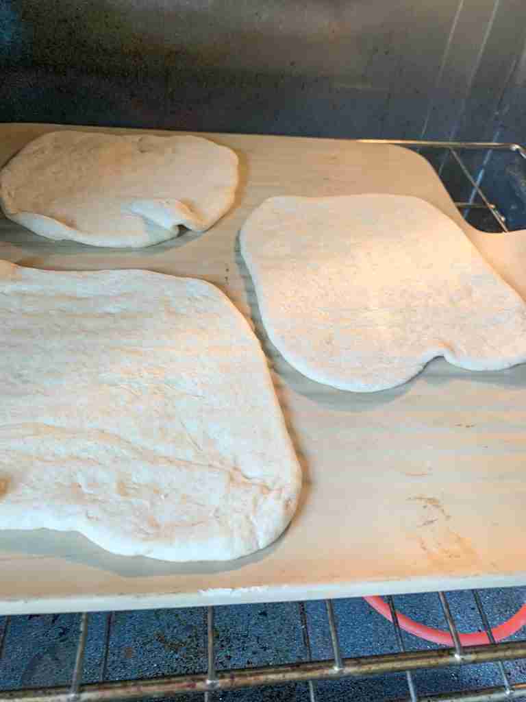 sourdough pita bread dough being baked
