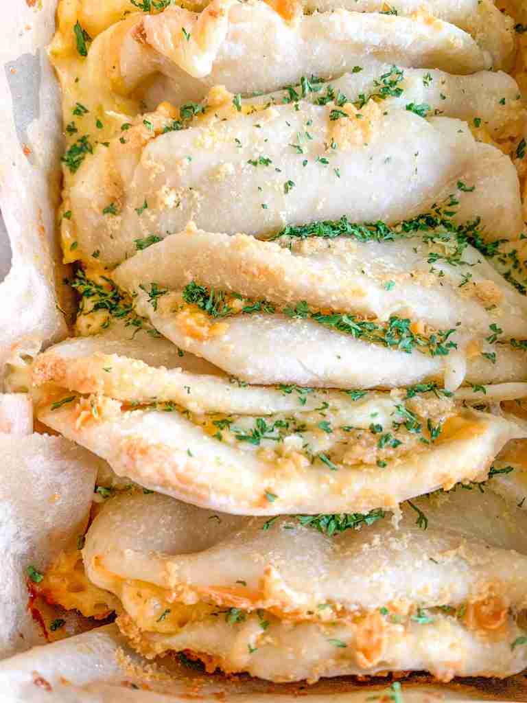 freshly baked cheesy sourdough garlic pull apart bread