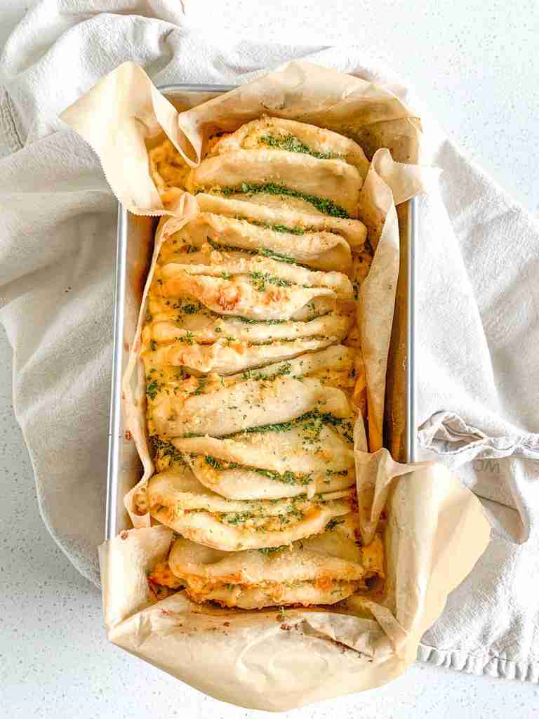freshly baked cheesy sourdough garlic pull apart bread
