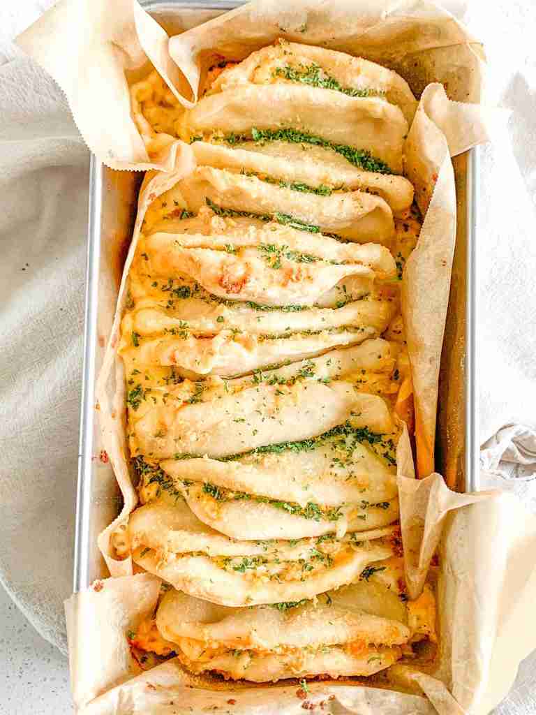 freshly baked cheesy sourdough garlic pull apart bread