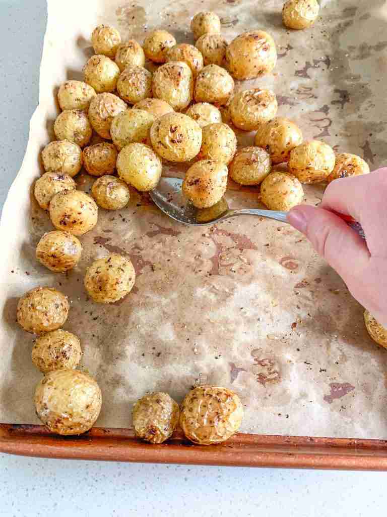 freshly roasted lemon potatoes being served