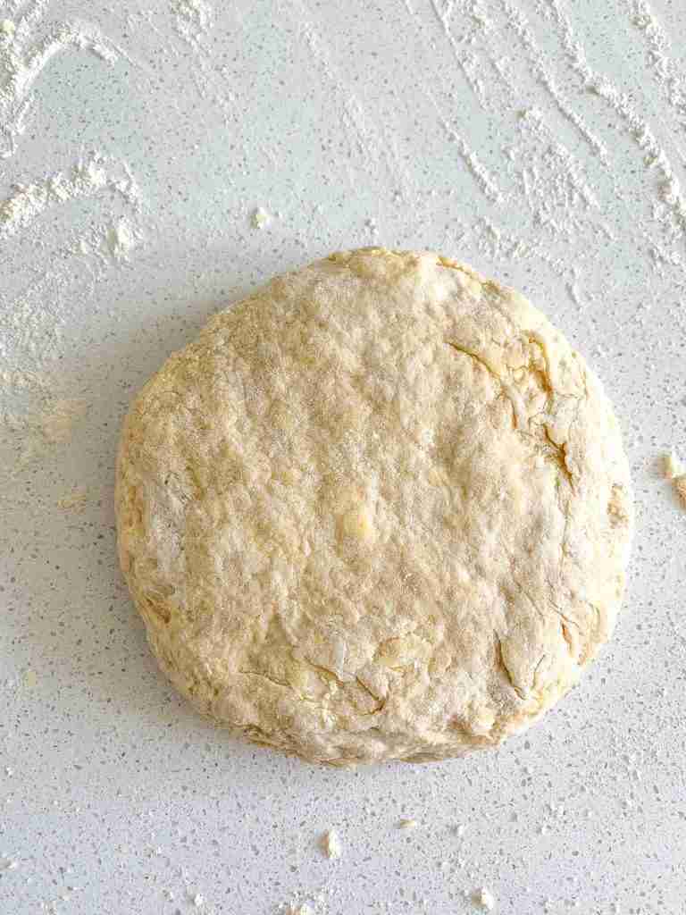 sourdough lemon scones dough shaped in a disk