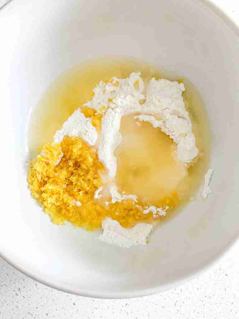 lemon glaze ingredients in a bowl for sourdough lemon scones