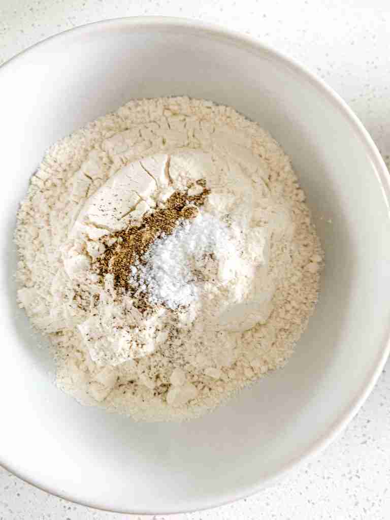 mixing flour mixture for Buttermilk Fried Chicken Tenders
