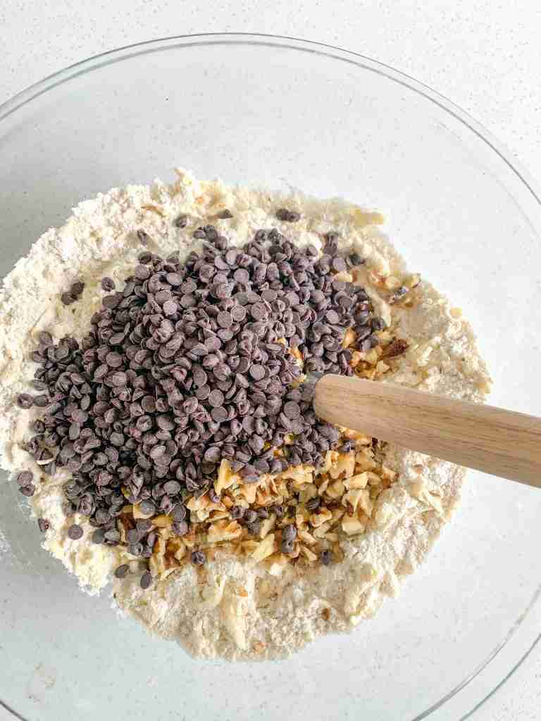 mixing chocolate and walnuts into sourdough derby pie scone dough