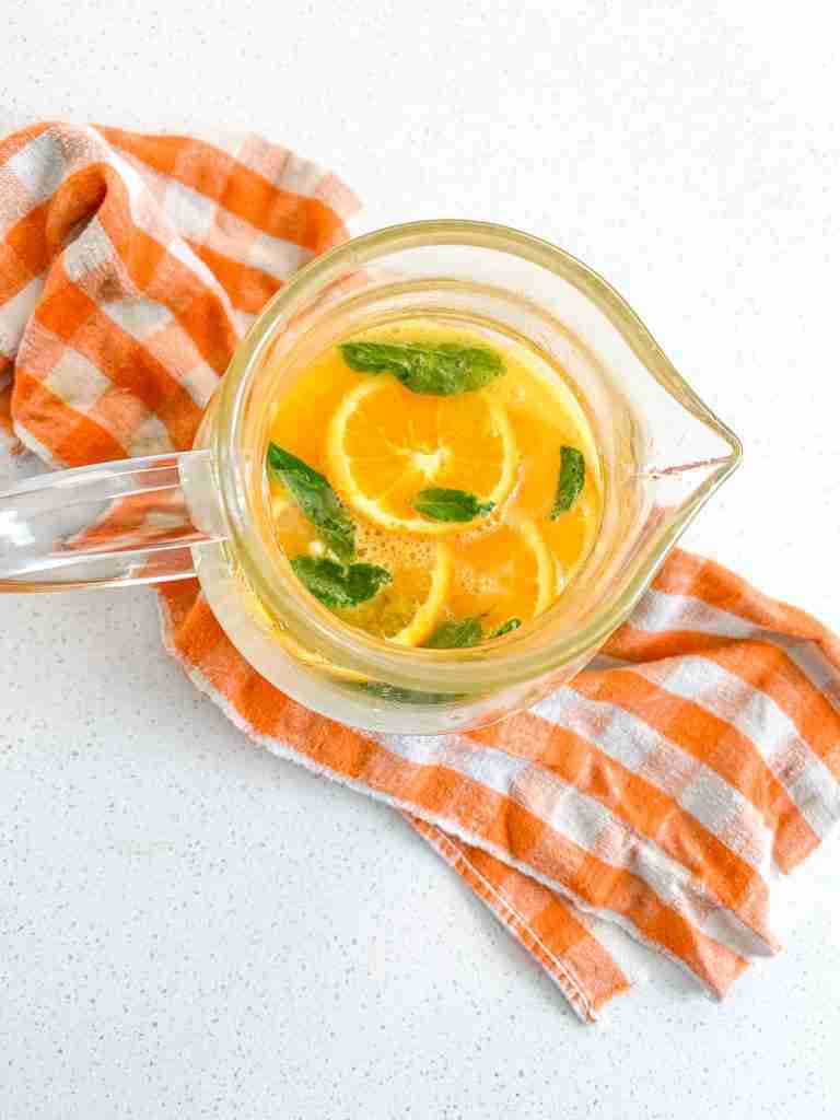 freshly made mint julep punch in a pitcher