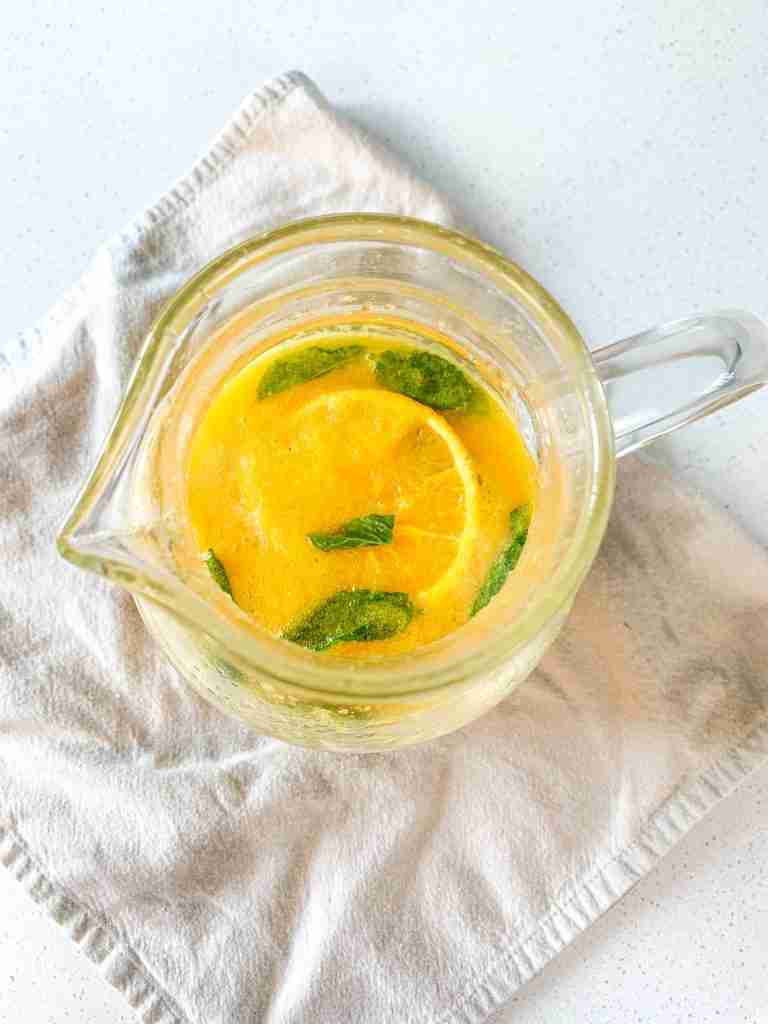 freshly made mint julep punch in a pitcher