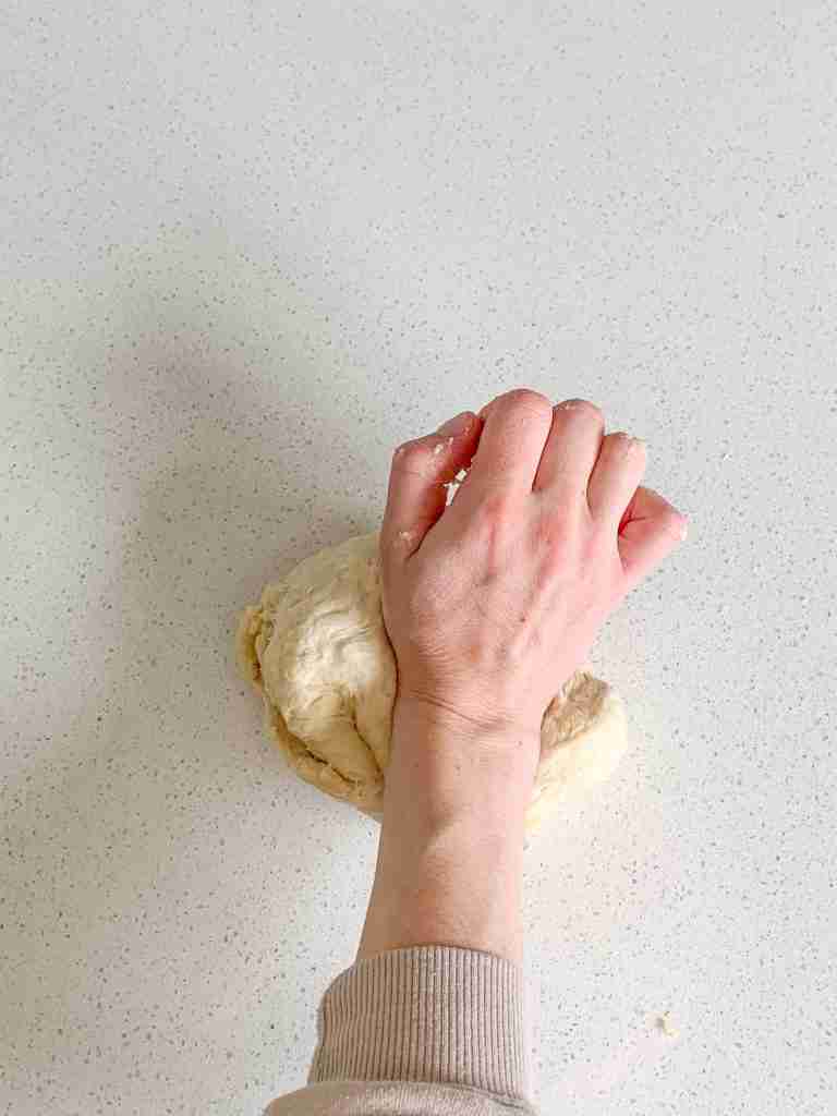 kneading sourdough brioche bun dough