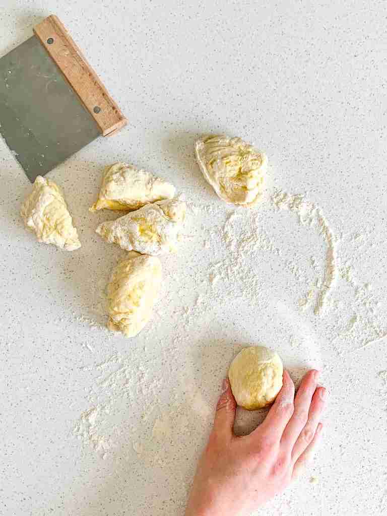 shaping sourdough brioche bun dough