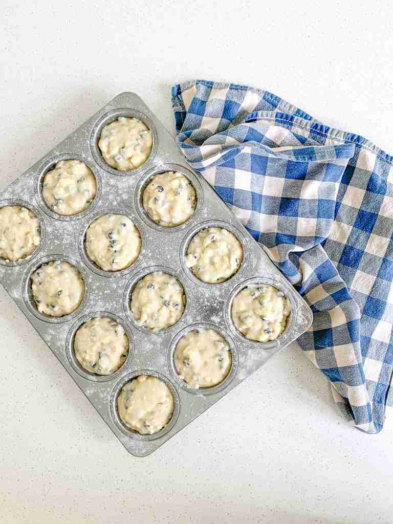 batter in tin for sourdough blueberry cheesecake muffins