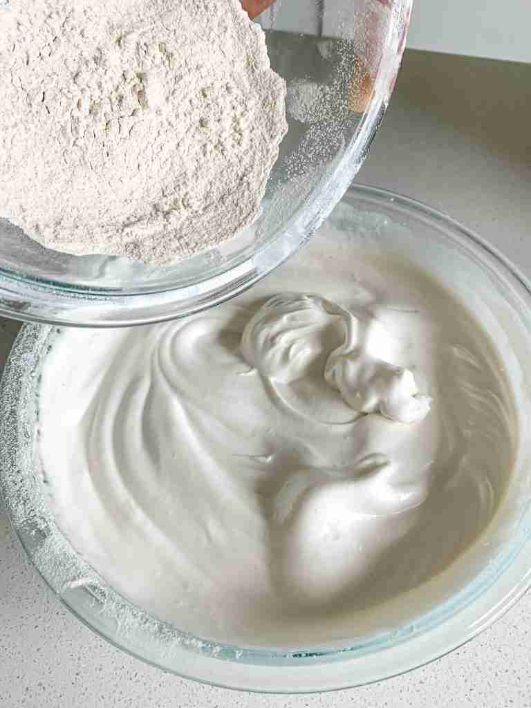 adding flour mix to sourdough angel food cake batter