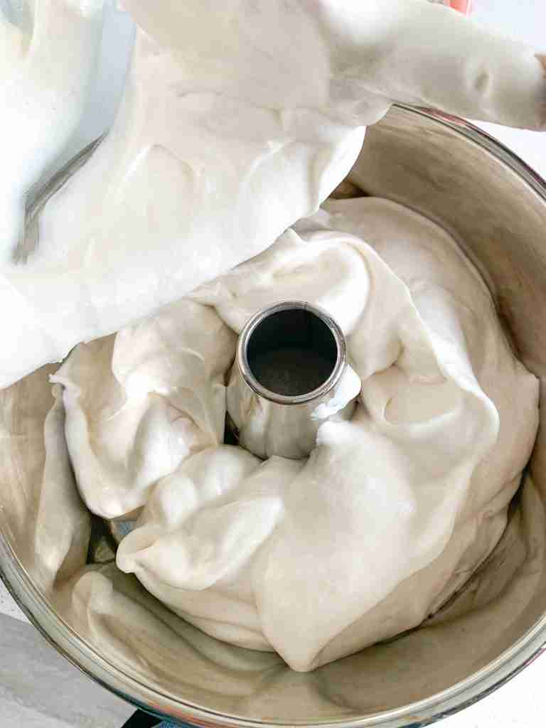 adding sourdough angel food cake batter into pan