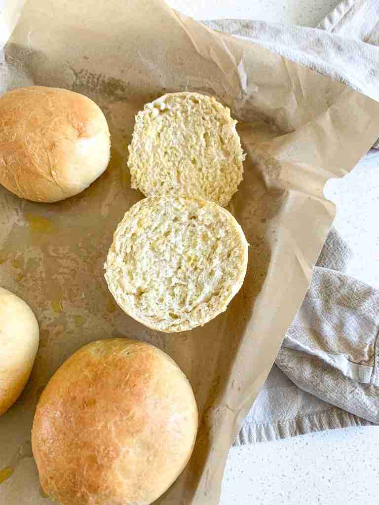 freshly baked sourdough brioche buns cut in half