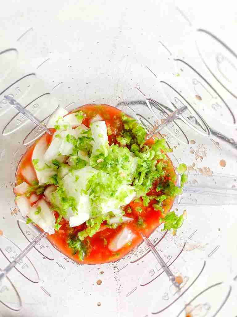 salsa ingredients put into a blender
