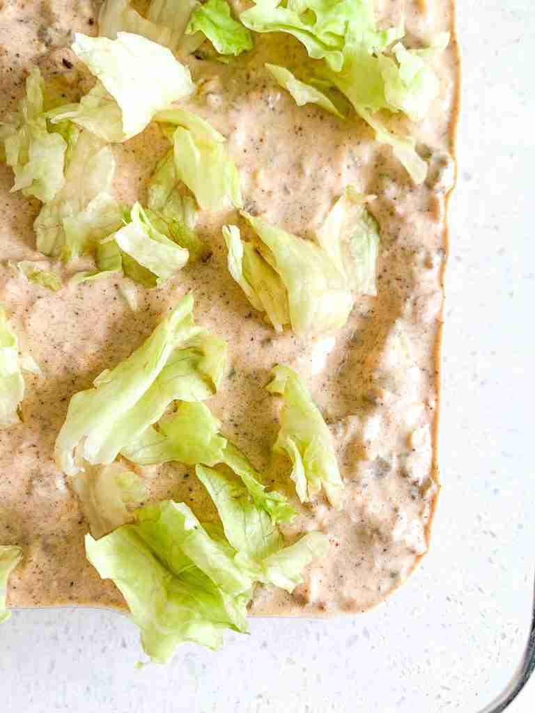 lettuce added on top of the dip