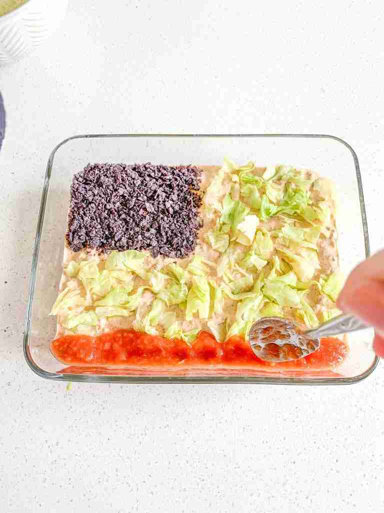 adding a stripe of salsa to the dip to make a flag