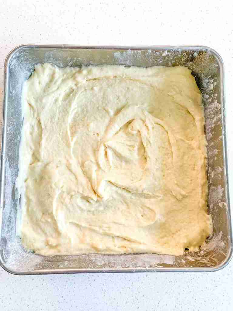sourdough cake batter in a pan