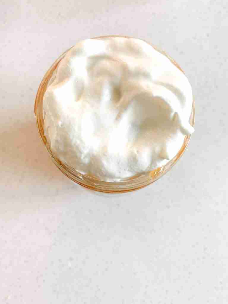 whipped cream layered on top mason jars for trifles