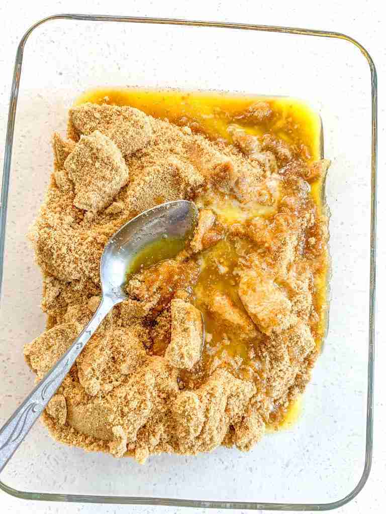 graham crackers and butter being mixed together