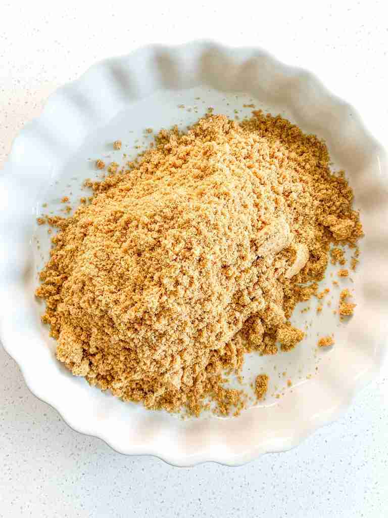 sand like graham cracker crumbs in a tart shell